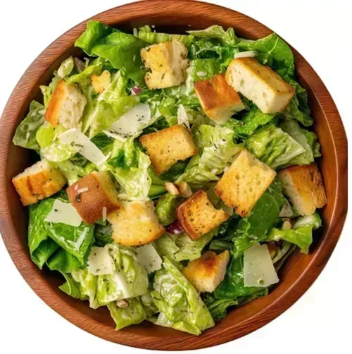 Caesar Salad — Romaine lettuce with crispy croutons, Parmesan, bacon, and signature dressing